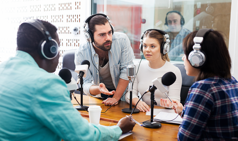 Radio hosts interviewing guest
