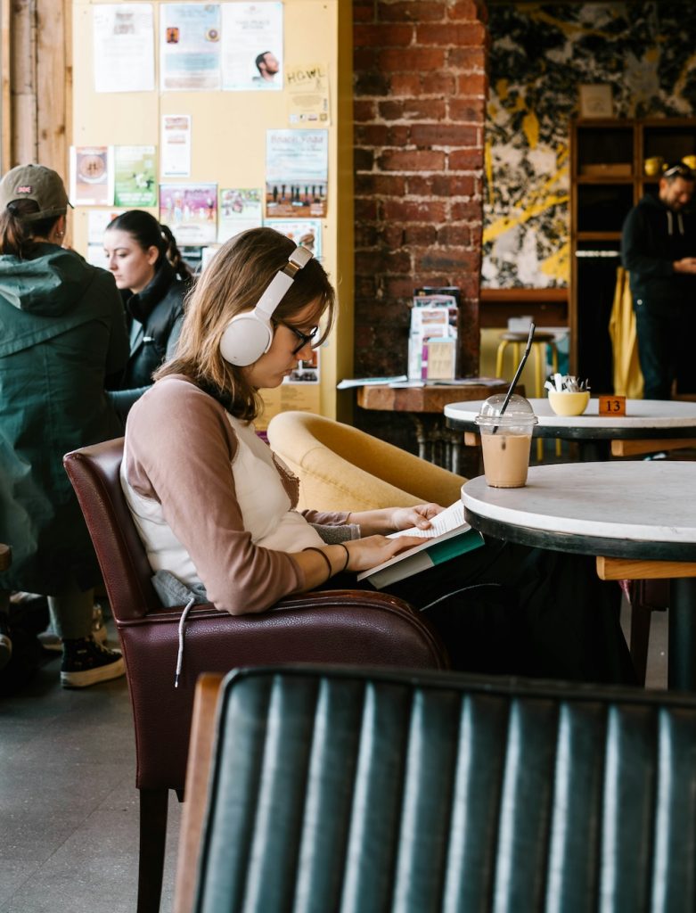 Podcast listener in a coffee shop